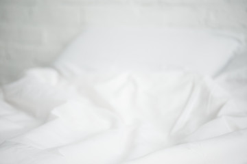 Fototapeta na wymiar selective focus of white empty bed and pillow