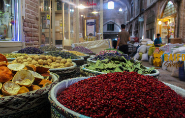 Spices in the great bazaar of Tabriz in Iran biggest market of the world. Containers and bucket of...