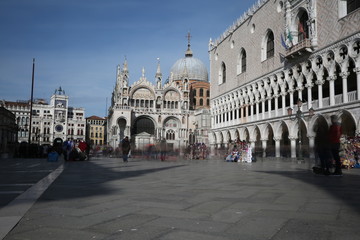 Fototapeta na wymiar Venice Ducal Palace Basilica of Saint Mark and people moving wit