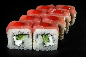 closeup roll sushi with tuna, cucumber, and philadelphia cream cheese