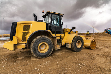 Fototapeta premium Excavator performing earthworks work in the expansion works of the Madrid-Segovia-Valladolid highway
