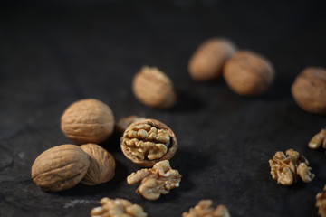 walnuts and nutcracker on wooden background