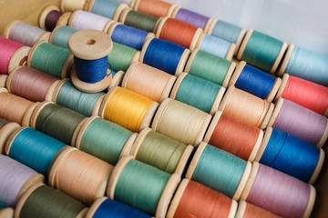 rolls of colorful threads, close-up and top view.