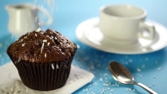 Dry coconut chips falling down on chocolate cake or dessert