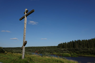 Orthodox cross on the river Bank. worship