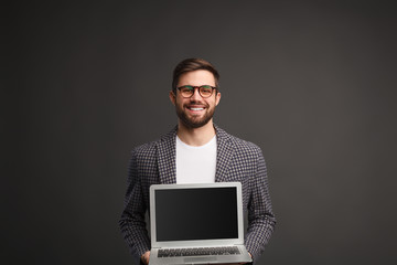 Young businessman with laptop