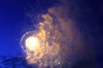 Celebratory fireworks in night time smoky closeup, concept celebration, festival, fun