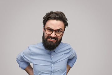 Angry bearded man looking at camera
