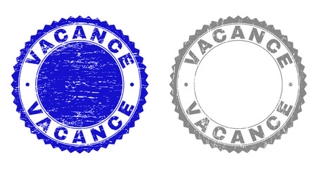 Grunge VACANCE stamps isolated on a white background. Rosette seals with grunge texture in blue and gray colors. Vector rubber stamp imprint of VACANCE label inside round rosette.