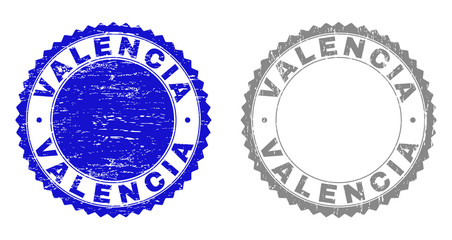 Grunge VALENCIA stamp seals isolated on a white background. Rosette seals with grunge texture in blue and grey colors. Vector rubber stamp imitation of VALENCIA text inside round rosette.