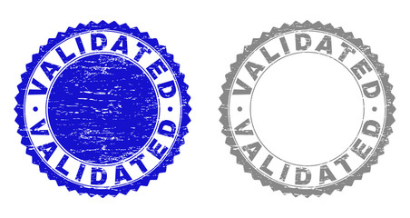 Grunge VALIDATED stamp seals isolated on a white background. Rosette seals with grunge texture in blue and gray colors. Vector rubber overlay of VALIDATED text inside round rosette.