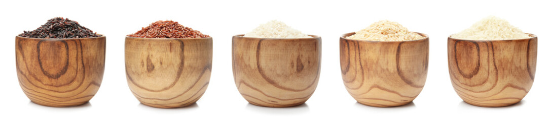 Set of wooden bowls with different uncooked rices on white background