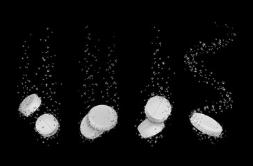 Set of water-soluble pills close-up on black background
