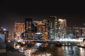 Fototapeta na wymiar DUBAI, UNITED ARAB EMIRATES - NOVEMBER 03, 2018: Night cityscape of marina district with illuminated buildings