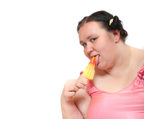 Overweight woman eating sweet ice lolly. Pleasure in summer hot day. Dieting and slimming theme. 