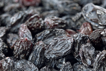 Tasty raisins as background, closeup. Healthy dried fruit