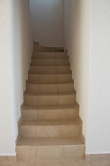 white staircase inside a house