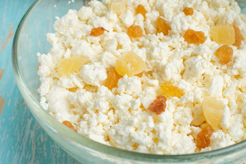 Cottage cheese with raisins and tsukati, close-up, macro