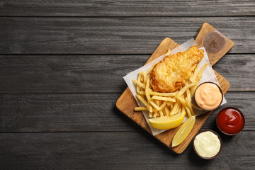 British traditional fish and potato chips on wooden background, top view with space for text - obrazy, fototapety, plakaty