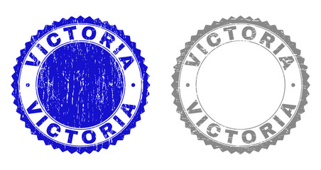 Obraz premium Grunge VICTORIA stamp seals isolated on a white background. Rosette seals with grunge texture in blue and grey colors. Vector rubber stamp imitation of VICTORIA caption inside round rosette.