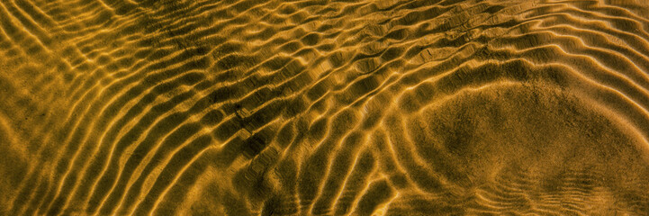 surface of water and waves in a clean river.