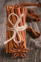 cinnamon sticks and anise. Spices for cooking homemade cookies. Cinnamon sticks tied by rope