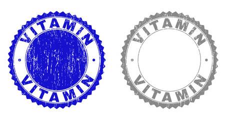Grunge VITAMIN stamp seals isolated on a white background. Rosette seals with grunge texture in blue and gray colors. Vector rubber stamp imprint of VITAMIN tag inside round rosette.