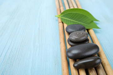 spa concept with zen basalt stones and orchid