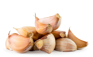 Heap of garlic slices on a white, isolated.