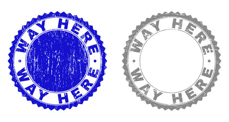 Grunge WAY HERE stamp seals isolated on a white background. Rosette seals with grunge texture in blue and gray colors. Vector rubber stamp imprint of WAY HERE label inside round rosette.