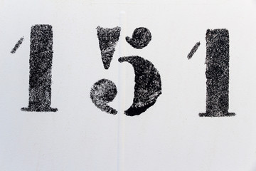 one hundred fifty one, number one hundred fifty one painted stencil on white backdrop
