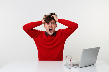 Manager in shock panic shouting, clutched his hands over his head, looks camera, made serious...
