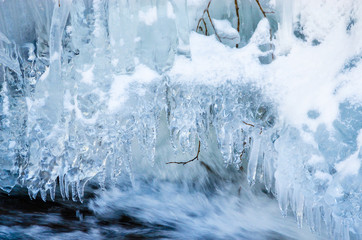 Beautiful mountain river in winter  with icicles
