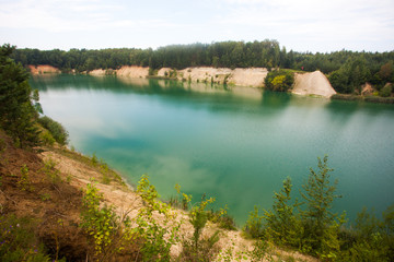 Fototapeta na wymiar Quarry, filled with turquoise water.
