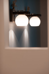 Two wall lamp with white shade. Minimalistic interior design.