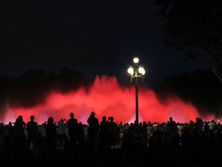 Many people enjoy the show of singing fountains,  Barcelona, Catalonia, Spain.