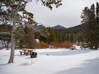Snowy campsite with picnic table