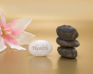Peaceful setting with floral and rocks to iillustrate calmness and health .