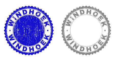 Grunge WINDHOEK stamp seals isolated on a white background. Rosette seals with distress texture in blue and grey colors. Vector rubber stamp imitation of WINDHOEK caption inside round rosette.