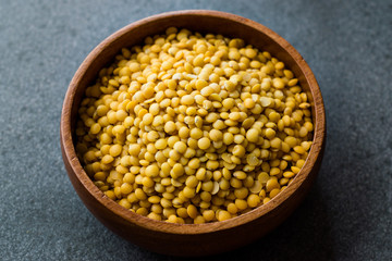 Yellow Lentils in Wooden Bowl.
