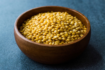 Yellow Lentils in Wooden Bowl.