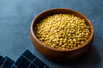 Yellow Lentils in Wooden Bowl.