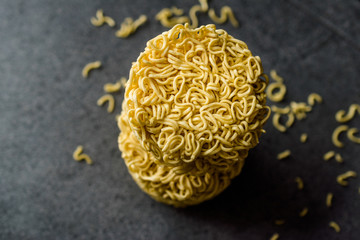 Raw Instant Noodles on Grey Surface.