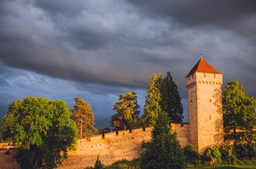 Old city wall and towers with rainbow in Luzern, Switzerland