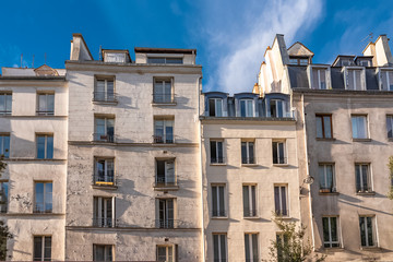 Paris, beautiful building in the center, typical parisian facade in the Marais