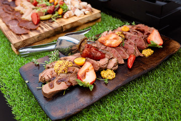 grilled steak with strawberries and french mustard 