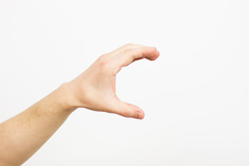 Hand showing size gesture isolated on white - copy space, blank, male finger palm