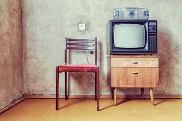 old room. retro tv, chair and cassette player