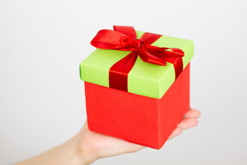 Hands holding beautiful gift box, female giving gift isolated, mock up
