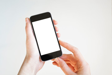Woman hand holding black smartphone with blank screen, isolated on white background.	